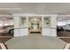 Secured building entrance with glass doors, a parking garage and welcoming mat at 33 S Gulfstream Ave # 306, Sarasota, FL 34236