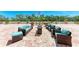 Spacious rooftop patio with comfortable outdoor furniture, planters, and a view at 33 S Gulfstream Ave # 306, Sarasota, FL 34236