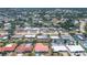 Aerial view of houses in a residential neighborhood, some with pools and solar panels at 3426 Brookline Dr, Sarasota, FL 34239