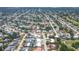 Wide aerial shot of a residential community showcasing well-maintained homes and tree-lined streets at 3426 Brookline Dr, Sarasota, FL 34239