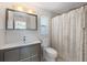 Modern bathroom featuring a vanity with granite countertop, mirror, and shower/tub combination at 3426 Brookline Dr, Sarasota, FL 34239
