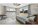 Bright bedroom with a ceiling fan, desk, and sliding door access to backyard at 3426 Brookline Dr, Sarasota, FL 34239