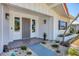 Inviting front entrance with a gray door, stone walkway, and well-maintained landscaping at 3426 Brookline Dr, Sarasota, FL 34239
