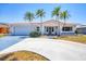 Charming single-story home with a well-manicured lawn, tile roof, and inviting curb appeal at 3426 Brookline Dr, Sarasota, FL 34239