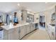 Contemporary kitchen with white cabinets, stainless steel appliances, and an open layout at 3426 Brookline Dr, Sarasota, FL 34239