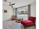 Bright and airy living room with tile flooring, large window, and comfortable seating at 3426 Brookline Dr, Sarasota, FL 34239