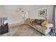 Spacious living room featuring a comfortable sofa, ceiling fan, and neutral tones at 3426 Brookline Dr, Sarasota, FL 34239