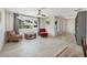 Open concept living space with tile floors, a large window, and neutral decor at 3426 Brookline Dr, Sarasota, FL 34239