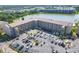 Beautiful aerial view of condo complex showcasing manicured landscaping, private parking, and serene lake views at 3521 Lake Bayshore Dr # 3521, Bradenton, FL 34205
