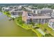 Aerial view showing the waterfront condo community with lake views and recreational amenities at 3521 Lake Bayshore Dr # 3521, Bradenton, FL 34205