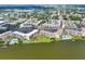 Scenic aerial view showcases this condo community along a picturesque lake at 3521 Lake Bayshore Dr # 3521, Bradenton, FL 34205