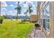 Backyard featuring a well manicured lawn and partial view of the lake at 3521 Lake Bayshore Dr # 3521, Bradenton, FL 34205