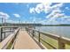 Community lake with beautiful wooden dock and landscaping view at 3521 Lake Bayshore Dr # 3521, Bradenton, FL 34205