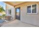 Inviting condo entrance featuring a covered porch, neutral stucco, and well-maintained landscaping for enhanced curb appeal at 3521 Lake Bayshore Dr # 3521, Bradenton, FL 34205