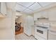 Well-lit kitchen features white appliances and tile flooring at 3521 Lake Bayshore Dr # 3521, Bradenton, FL 34205
