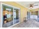 Lanai featuring tile flooring, ceiling fan, and a sliding glass door to the home's interior at 3521 Lake Bayshore Dr # 3521, Bradenton, FL 34205