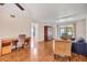 Open-concept living room with wood flooring, neutral walls, comfortable seating, and access to the screened-in lanai at 3521 Lake Bayshore Dr # 3521, Bradenton, FL 34205