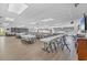 A large recreation room with tables, chairs, and a library, ideal for community activities at 3521 Lake Bayshore Dr # 3521, Bradenton, FL 34205
