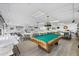 Spacious rec room featuring a pool table, multiple seating areas, and a cozy library at 3521 Lake Bayshore Dr # 3521, Bradenton, FL 34205