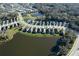 A high altitude aerial view of a community with multiple lakes and mature trees at 3631 Shimmering Oaks Dr, Parrish, FL 34219