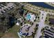 Aerial view of a community pool, a playground, parking area and recreation area at 3631 Shimmering Oaks Dr, Parrish, FL 34219