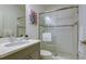 Bright bathroom featuring a glass-enclosed shower, modern vanity, and decorative wall art at 3631 Shimmering Oaks Dr, Parrish, FL 34219