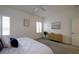 Bedroom with a cozy bed, a window with shutters, and a dresser with a plant at 3631 Shimmering Oaks Dr, Parrish, FL 34219