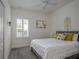 Cozy bedroom with a comfortable bed, bright decor and a window with white shutters at 3631 Shimmering Oaks Dr, Parrish, FL 34219