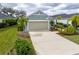 Charming single-story home with a well-manicured lawn, a two-car garage, and a welcoming driveway at 3631 Shimmering Oaks Dr, Parrish, FL 34219