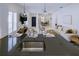 Open concept living area with marble floors and views of the kitchen and dining area at 3631 Shimmering Oaks Dr, Parrish, FL 34219