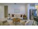 Bright living room features a modern sofa, round coffee table, and stylish decor at 3631 Shimmering Oaks Dr, Parrish, FL 34219