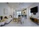 Spacious living room with views of the kitchen and dining area, creating an inviting open-concept space at 3631 Shimmering Oaks Dr, Parrish, FL 34219