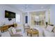 Bright and open living room with views into the kitchen and dining area, featuring contemporary decor at 3631 Shimmering Oaks Dr, Parrish, FL 34219