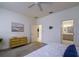 Airy bedroom with neutral walls, soft carpet, and access to the ensuite bathroom at 3631 Shimmering Oaks Dr, Parrish, FL 34219