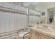 This bathroom features a shower-tub combo with a white shower curtain and a single sink vanity at 3804 Amapola Ln, Sarasota, FL 34238