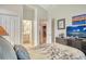 This bedroom features carpet, a window to the bathroom, and dark wooden furniture at 3804 Amapola Ln, Sarasota, FL 34238