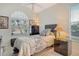 This bedroom features carpet, a window with blinds, and dark wooden furniture at 3804 Amapola Ln, Sarasota, FL 34238