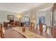 Dining room showcasing an elegant dining table, view of home office, and natural light at 3804 Amapola Ln, Sarasota, FL 34238