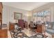 Home office showing built-in storage and two work stations with backyard views at 3804 Amapola Ln, Sarasota, FL 34238