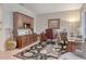 Well-lit home office featuring built-in cabinets, desk space, and a comfortable seating area at 3804 Amapola Ln, Sarasota, FL 34238