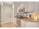 Updated kitchen featuring stainless appliances, granite counters, and ample cabinet space at 3804 Amapola Ln, Sarasota, FL 34238