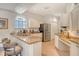 Bright kitchen features stainless steel appliances, granite countertops, breakfast bar seating and tile flooring at 3804 Amapola Ln, Sarasota, FL 34238