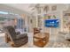 Bright living room featuring a sliding glass door and comfortable seating at 3804 Amapola Ln, Sarasota, FL 34238