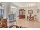 Cozy formal living room adjoining dining area with elegant decor and natural light at 3804 Amapola Ln, Sarasota, FL 34238