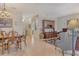 Open concept living and dining area showcasing tile flooring and traditional furnishings at 3804 Amapola Ln, Sarasota, FL 34238
