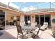 Relax on the patio with an outdoor kitchen and sliding glass doors to indoors at 3804 Amapola Ln, Sarasota, FL 34238