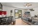Bright living space features a sliding glass door leading to the backyard and blending indoor-outdoor living at 3881 Holin Ln, North Port, FL 34287