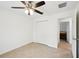 This bedroom features tile flooring, a ceiling fan, and a closet at 4091 Dull St, North Port, FL 34286