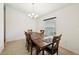 Dining room featuring wood table with seating for six and a modern chandelier at 4091 Dull St, North Port, FL 34286