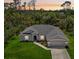 Charming single-story home featuring a well-manicured lawn and a two-car garage at 4091 Dull St, North Port, FL 34286